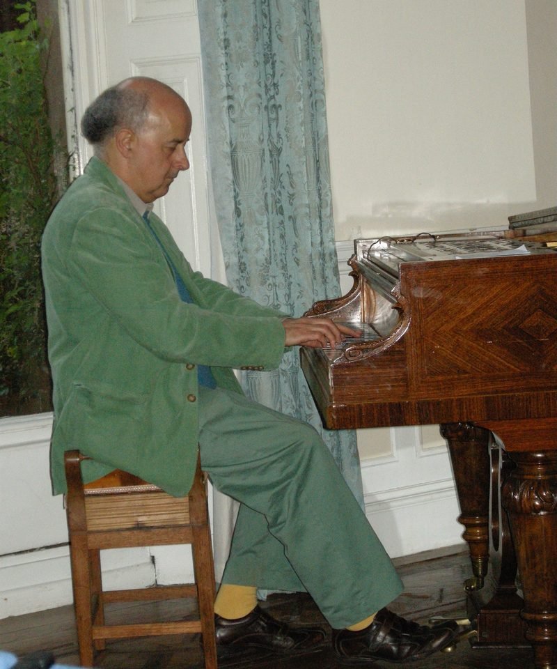 Lawrence Ball playing a grand piano